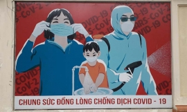 Manifesto di propaganda per le strade di Hồ Chí Minh City: “Il popolo unito nel combattere il Covid-19”.